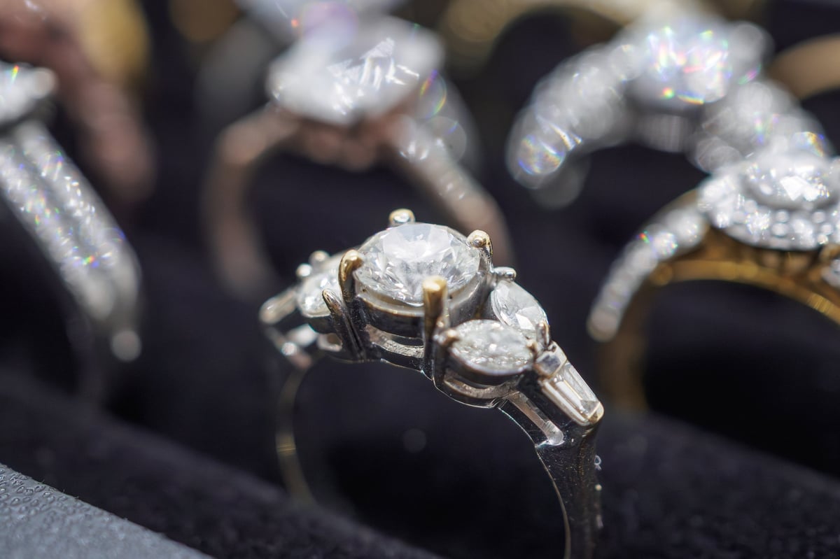 Diamond rings displayed in a luxury retail store window showcase